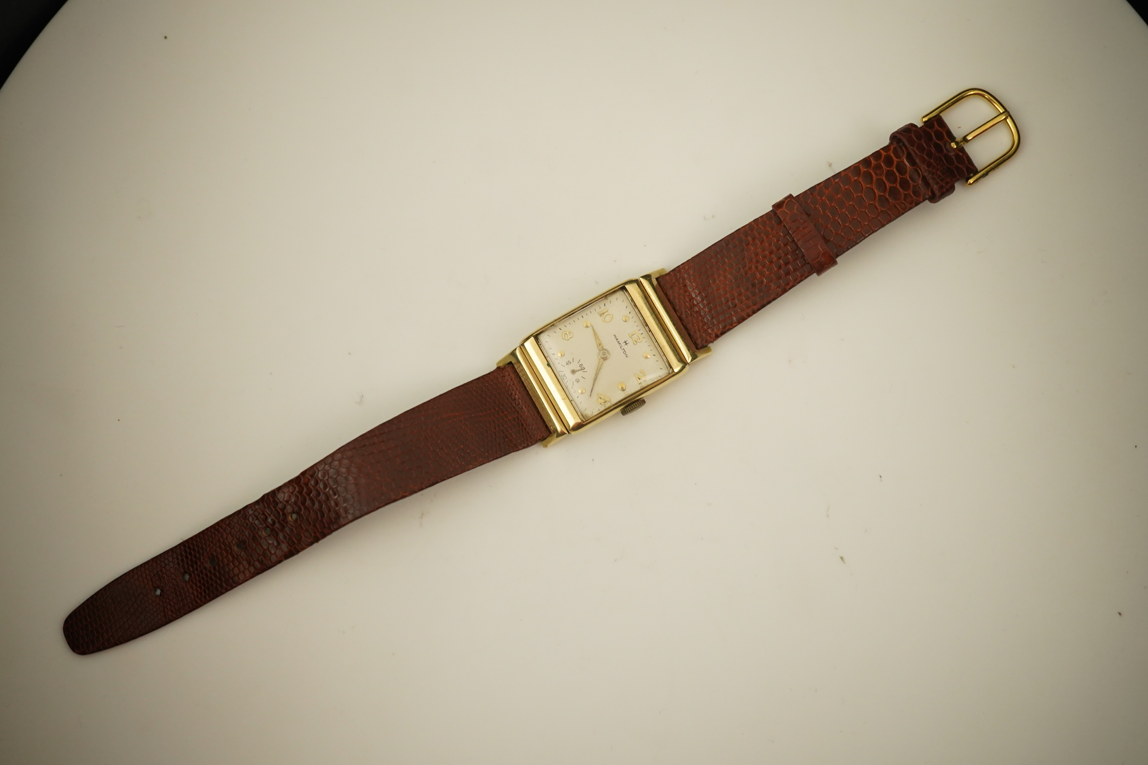 A gentleman's 1950's? 14k gold Hamilton manual wind wrist watch, on a later associated leather strap